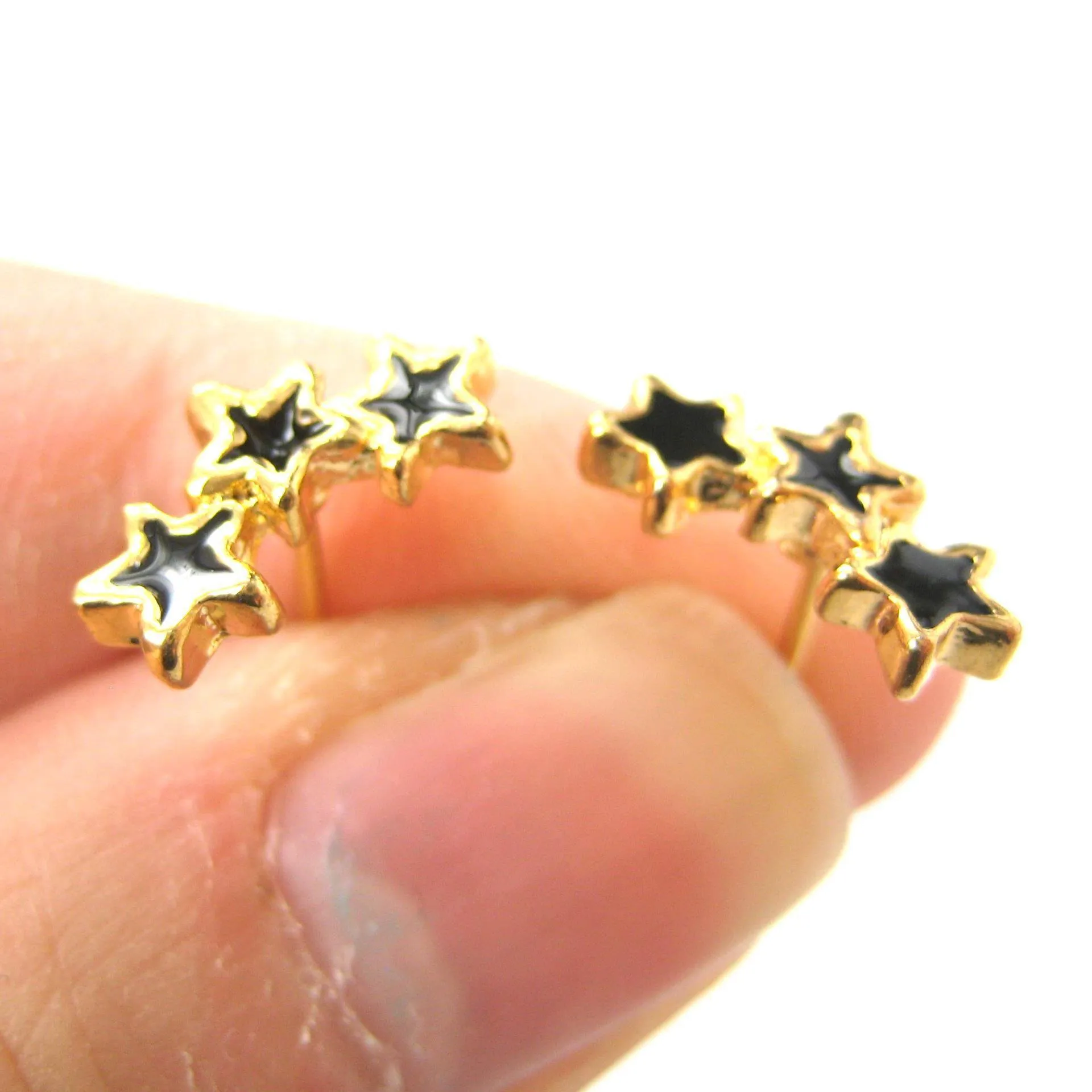 Small Connected Star Shaped Stud Earrings in Black on Gold